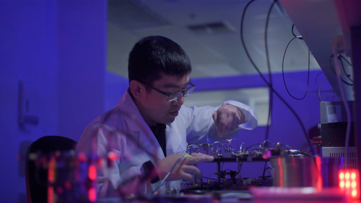 QuantX Lab’s Yong Ooi working on one of the company's world-leading technologies